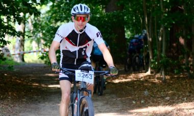 Cyclists overlooking Sierra de Cazorla mountains and valley at sunrise